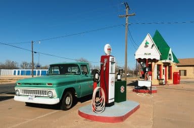Antique truck at a gas station