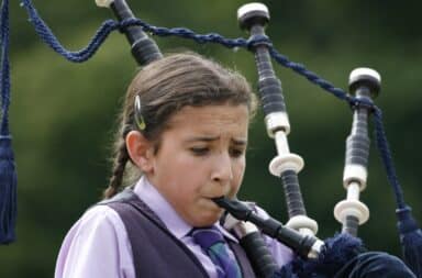 girl playing bagpipes