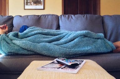 lazy on the couch under a blanket