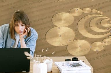 woman writing an email, crop circle in the background