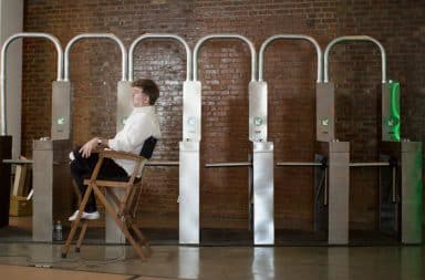 Director of musical in subway set with turnstiles