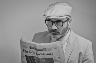 Man reading The New York Times paper