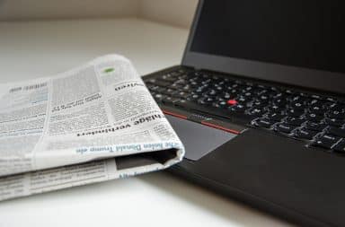news paper and laptop