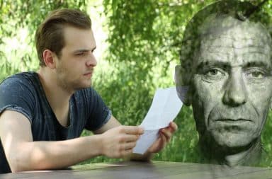 guy sad reading a letter from a ghost which is spooky and sad!