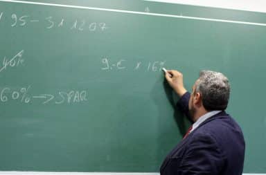 teacher at the chalkboard