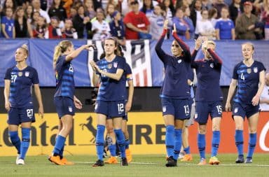 USWNT players on the soccer pitch